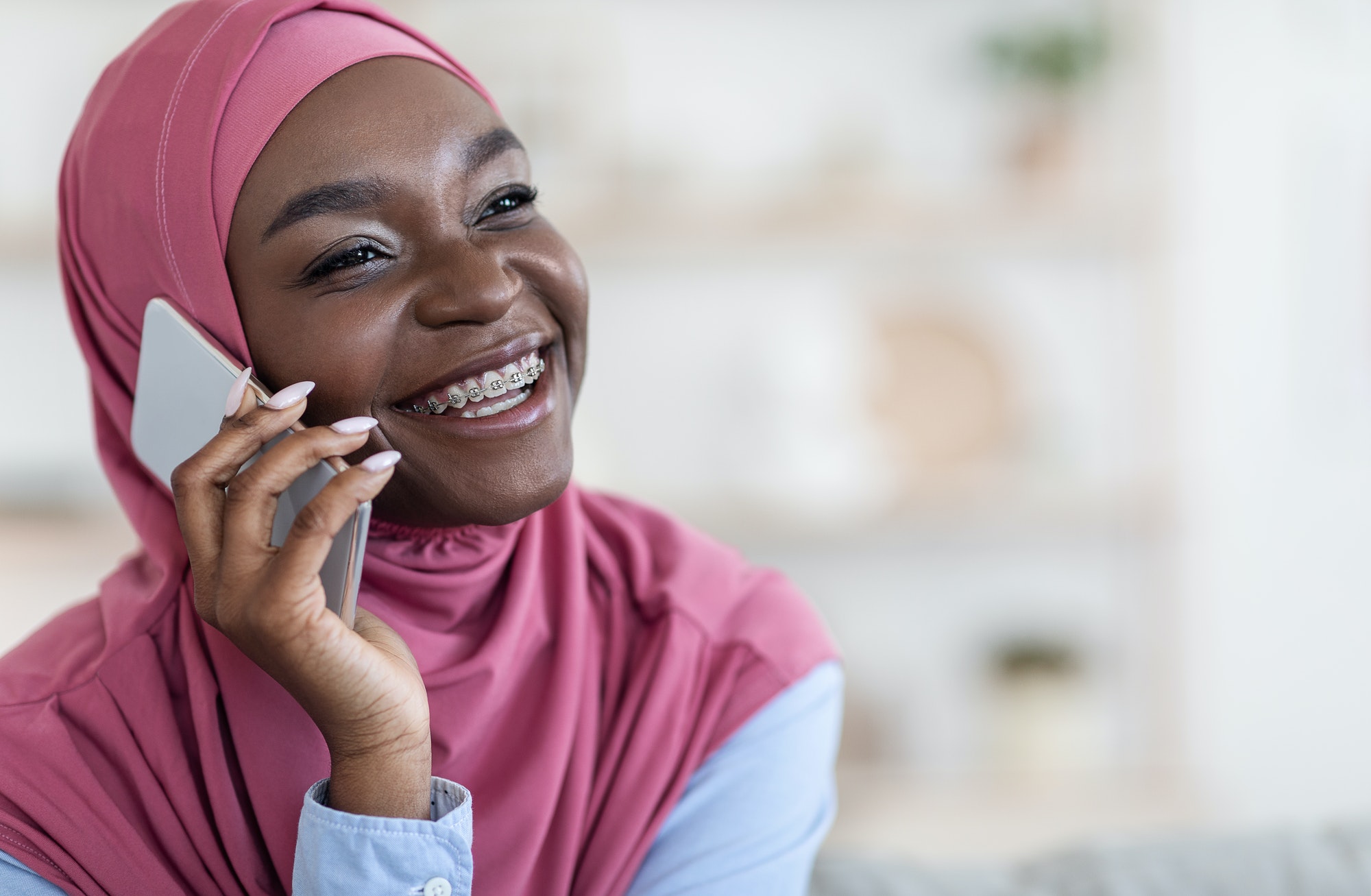 Phone Talk. Cheerful Black Muslim Woman Speaking On Mobile Phone, Closeup Portrait